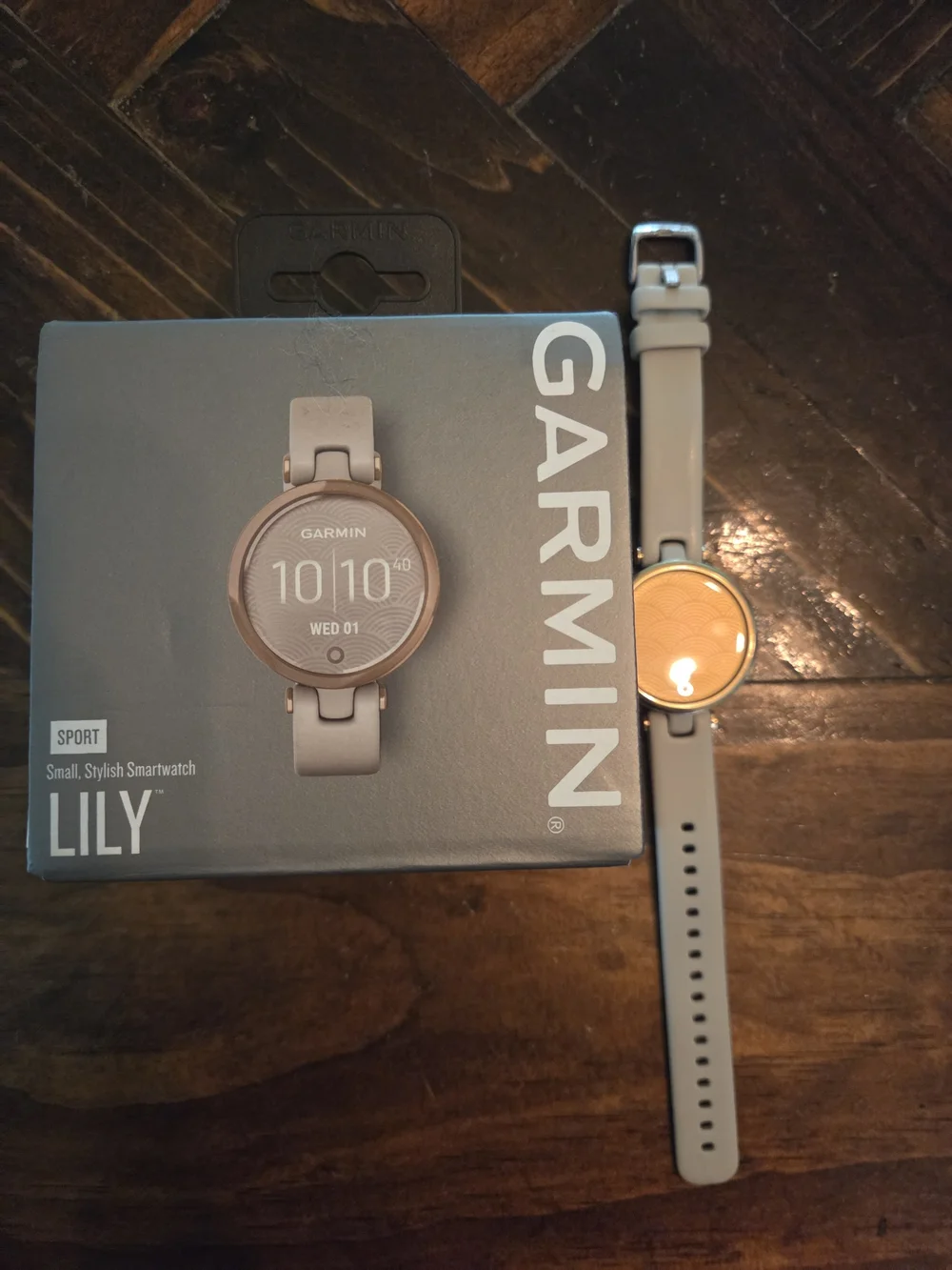 garmin beige smartwatch with rose gold